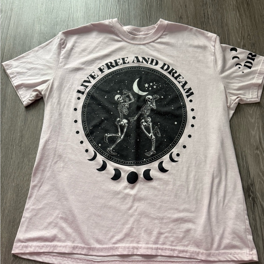 Pink Graphic Tee With Moon Phases and Skeleton Design
